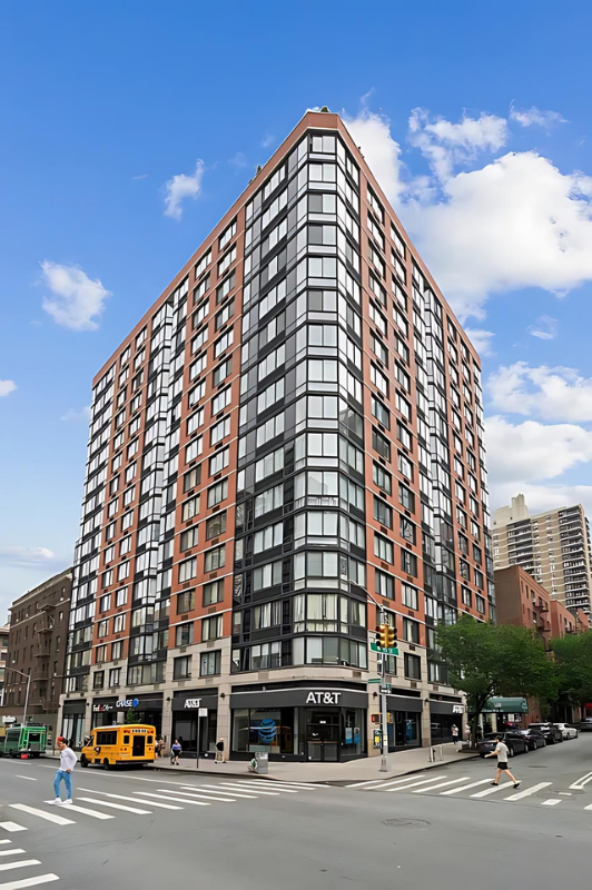 215 West 95th Street, Unit 9J Manhattan, NY 10025 - Photo 10 of 11 a view of a tall building next to a road