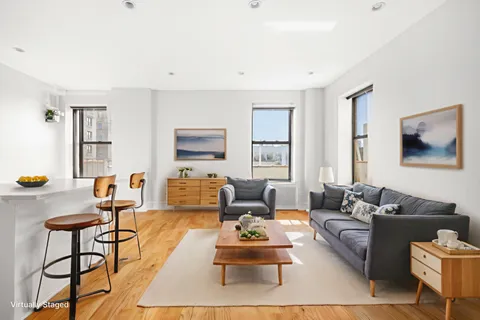 a living room with furniture and a table