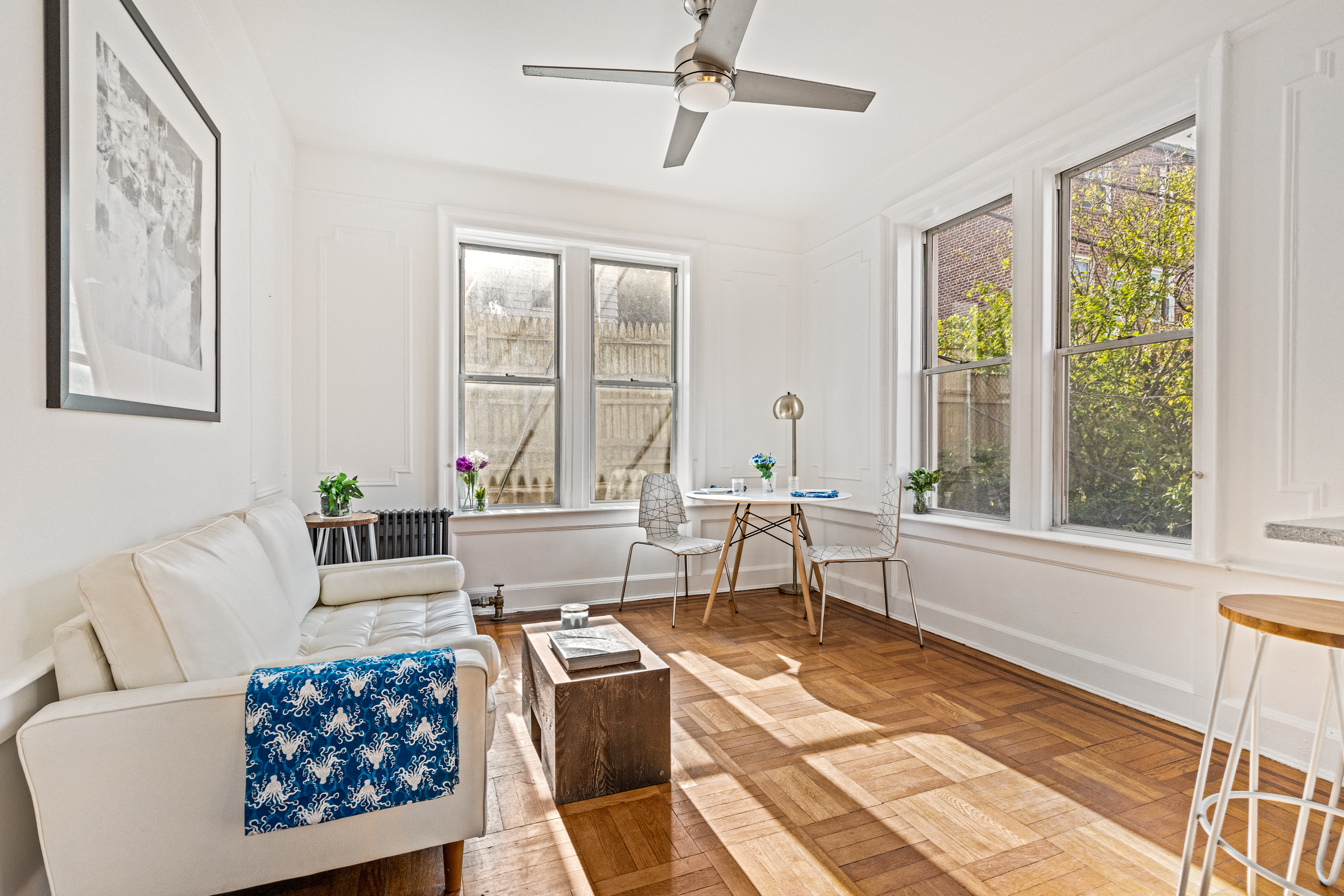4006 7th Avenue, Unit 14 Brooklyn, NY 11232 - Photo 1 of 17 a living room with furniture large window and rug