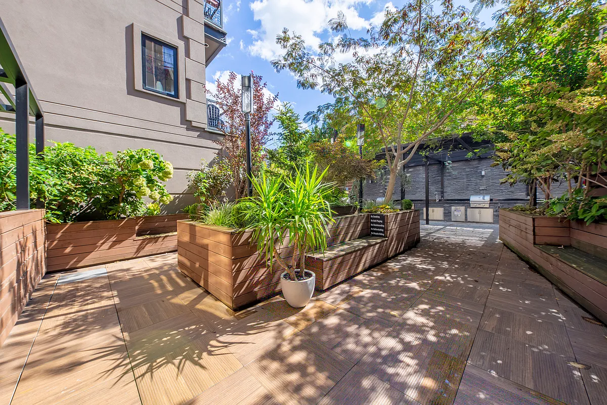 42 Maspeth Avenue, Unit 1B Brooklyn, NY 11211 - Photo 6 of 12 a view of a backyard with sitting area