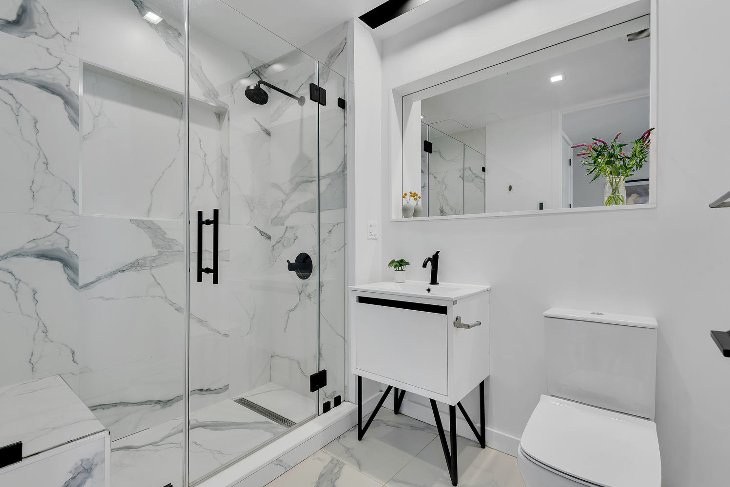 267 Evergreen Avenue, Unit PH Brooklyn, NY 11221 - Photo 10 of 19 a bathroom with a toilet sink and shower