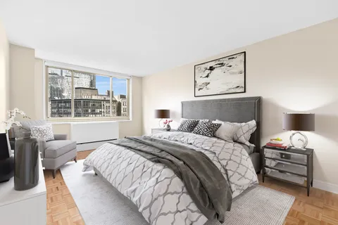 a bedroom with a bed and a couch