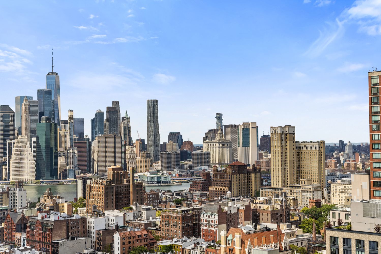 a view of city and a tall buildings