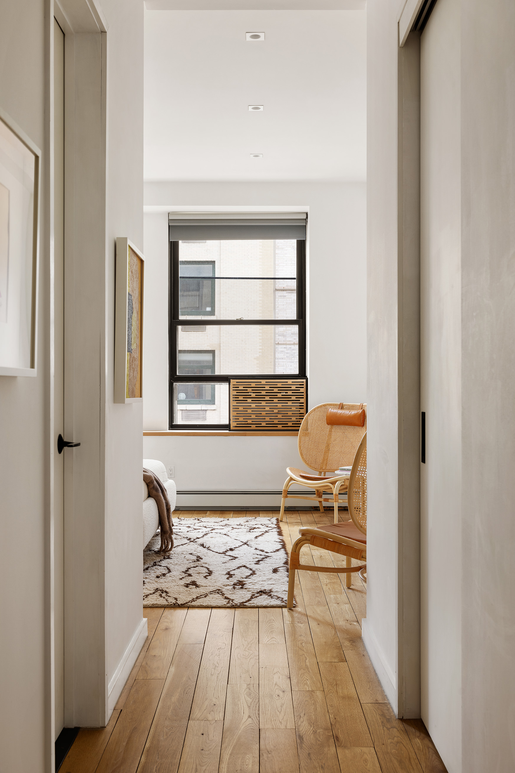 250 Mercer Street, Unit B706B707 Manhattan, NY 10012 - Photo 20 of 25 a bedroom with a bed and chair