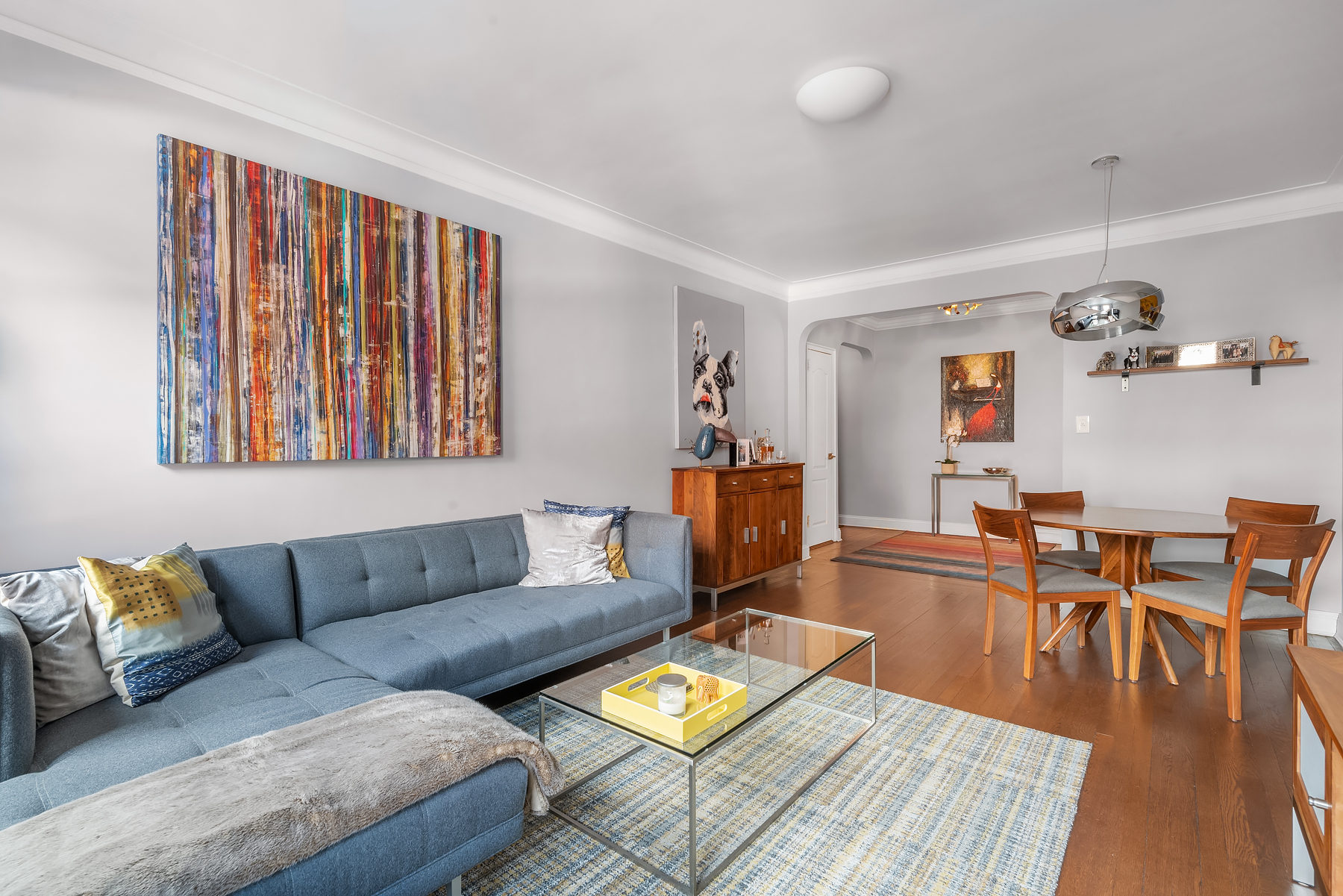 166 West 22nd Street, Unit 2A Manhattan, NY 10011 - Photo 1 of 8 a living room with furniture and wooden floor