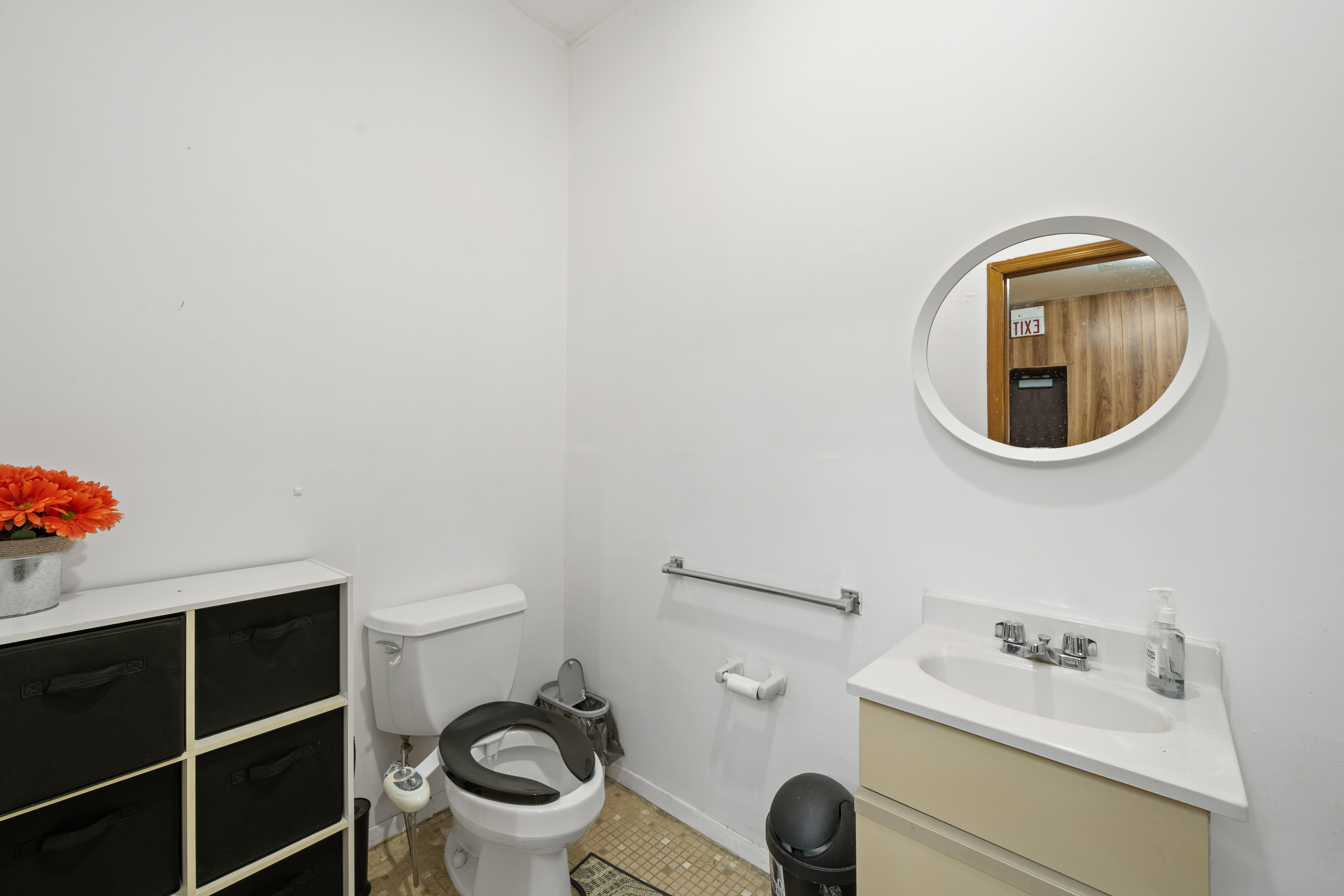 162 Mallory Avenue Jersey City, NJ 07304 - Photo 9 of 29 a bathroom with a sink and a toilet