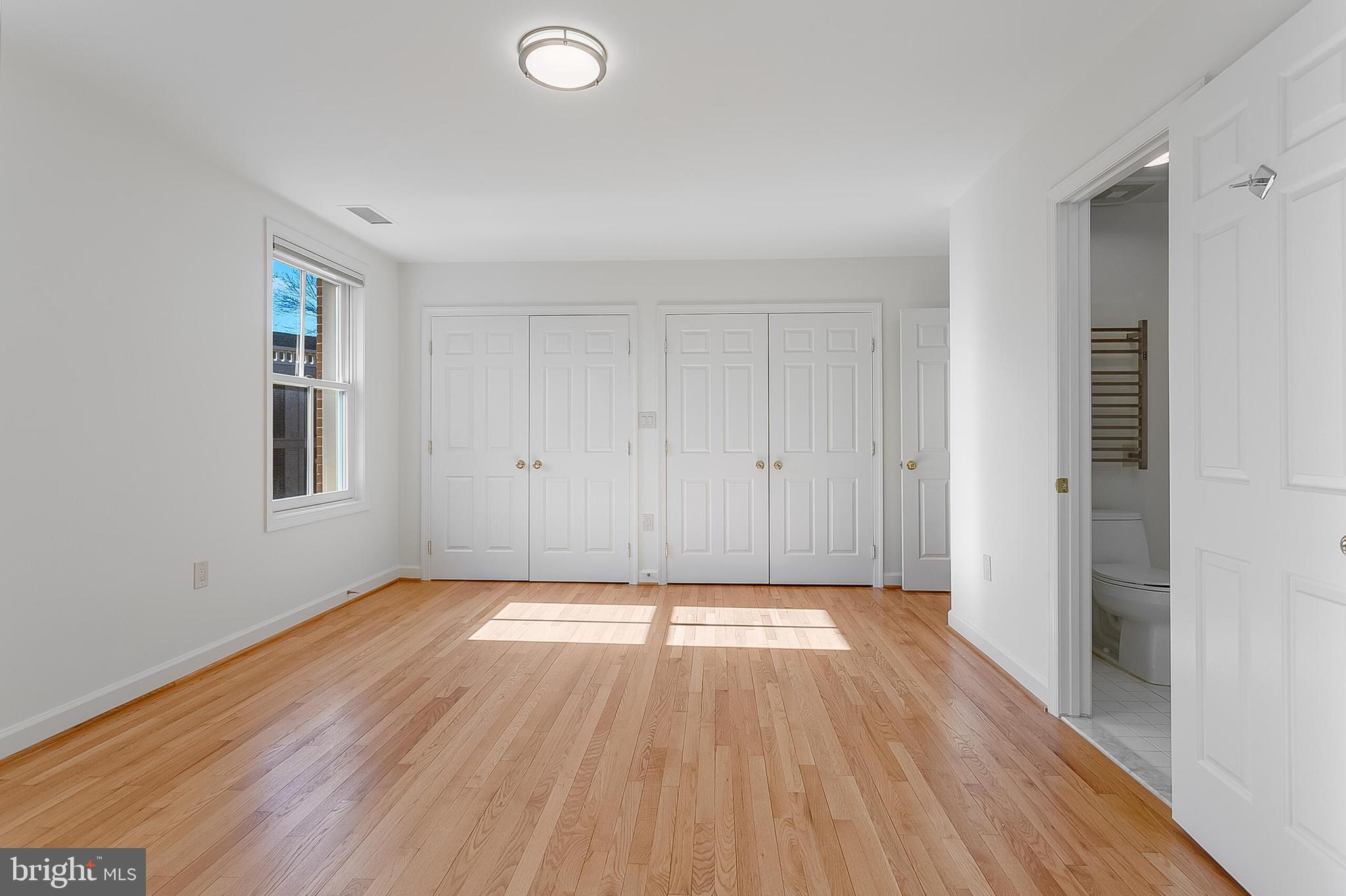 4709 Foxhall Crescent Northwest Washington, DC 20007 - Photo 43 of 57 a view of an empty room with wooden floor