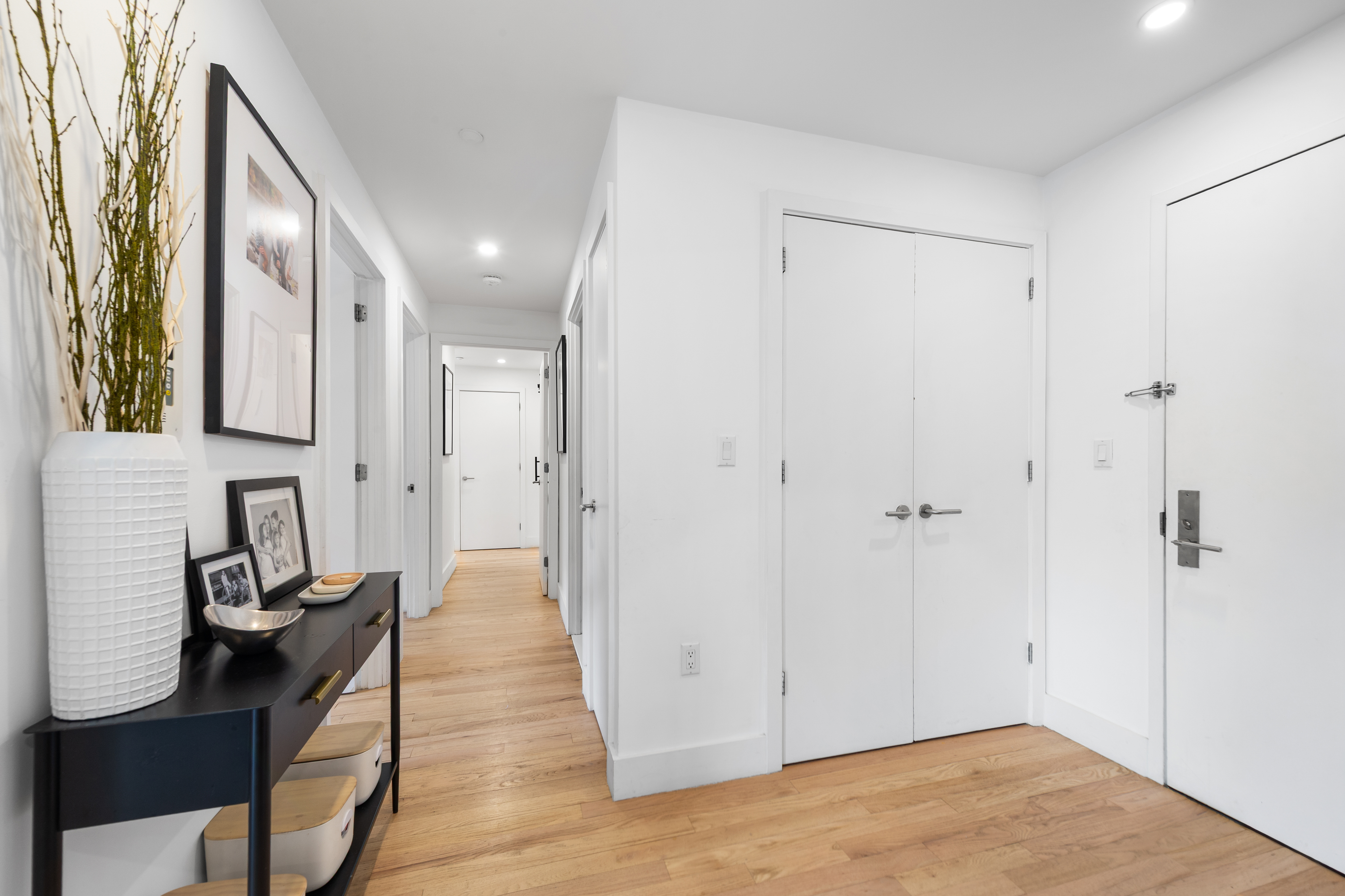 2110 Frederick Douglass Boulevard, Unit 4C Manhattan, NY 10026 - Photo 6 of 19 a view of a hallway with wooden floor