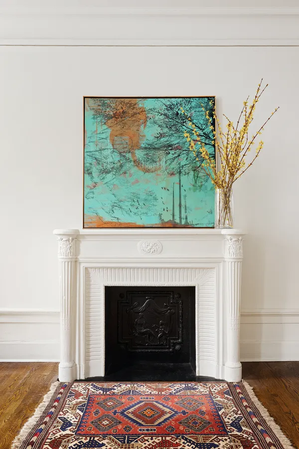 a living room with a fireplace and a fireplace