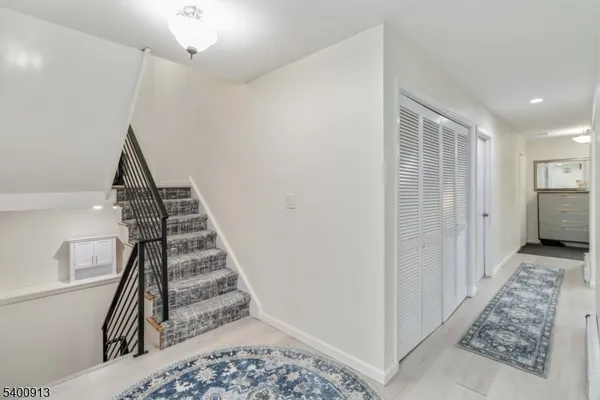 a view of entryway with wooden floor
