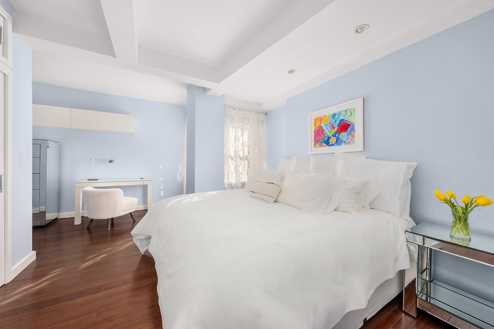 2166 Broadway, Unit 5D Manhattan, NY 10024 - Photo 5 of 11 a bedroom with a bed and a chandelier