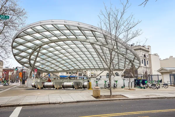 a view of a patio with chairs and potted plants