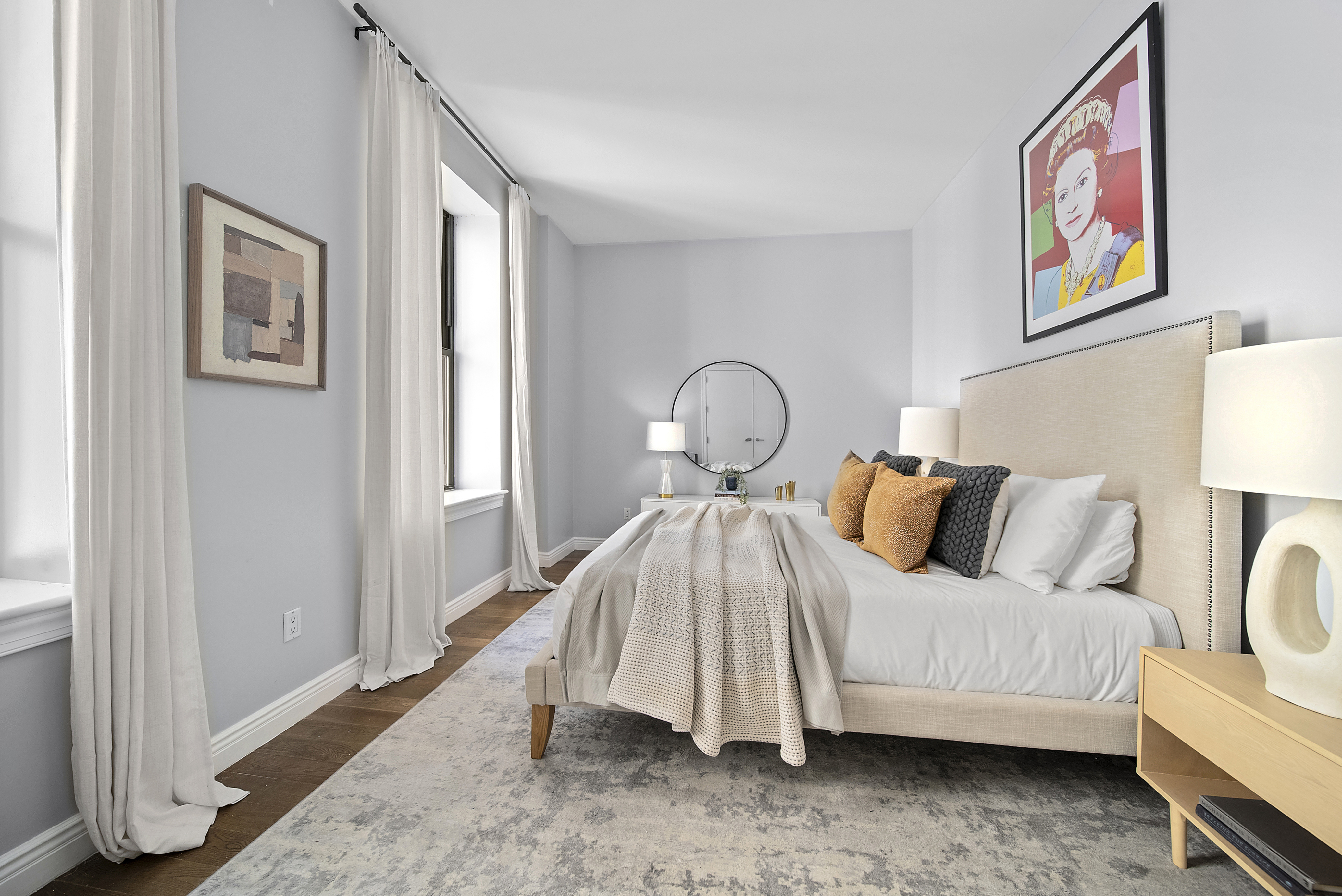 225 5th Avenue, Unit 7K Manhattan, NY 10010 - Photo 10 of 15 a bedroom with a bed and a painting on the wall