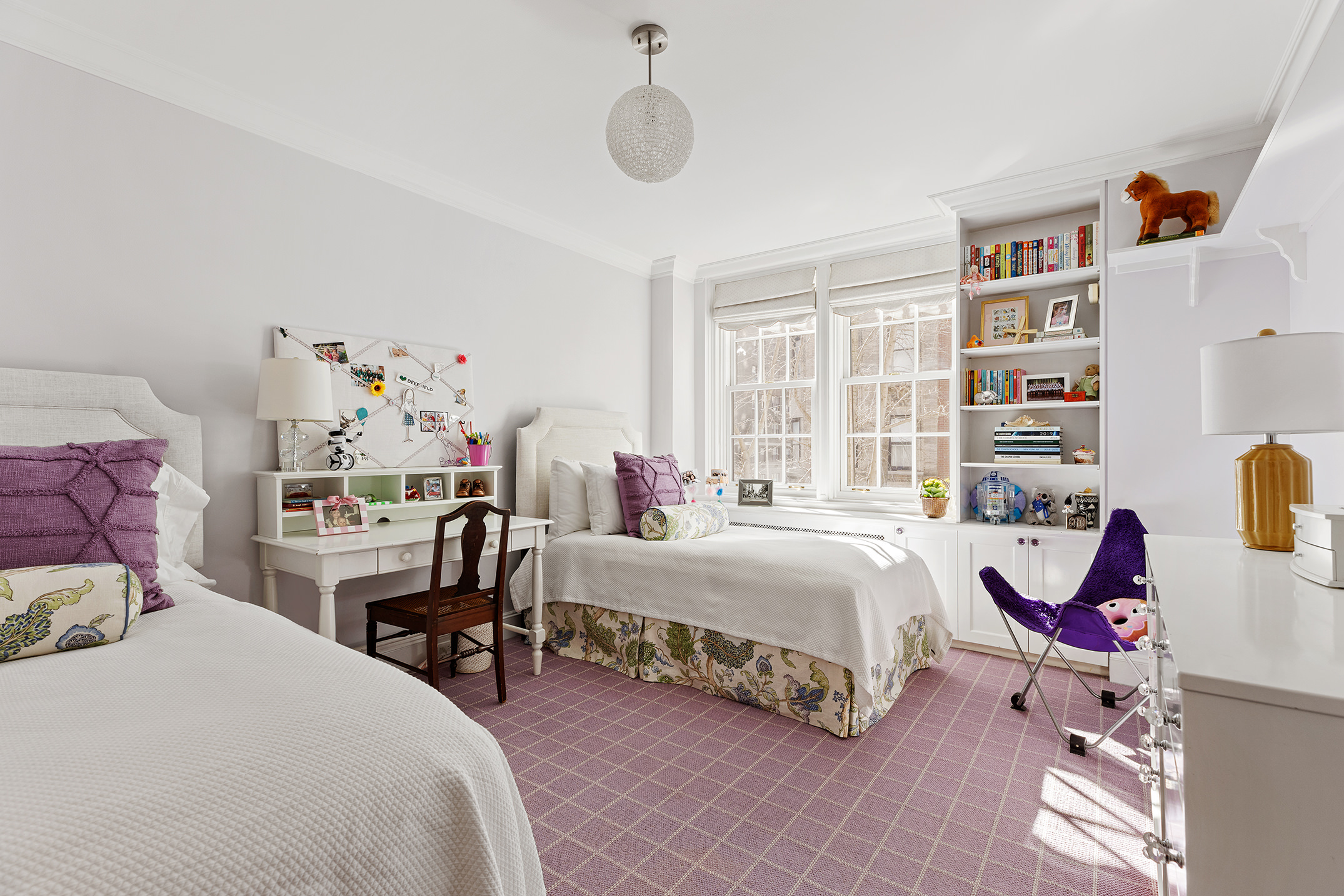 133 East 80th Street, Unit 3A Manhattan, NY 10075 - Photo 9 of 19 a bedroom with a bed and a chandelier