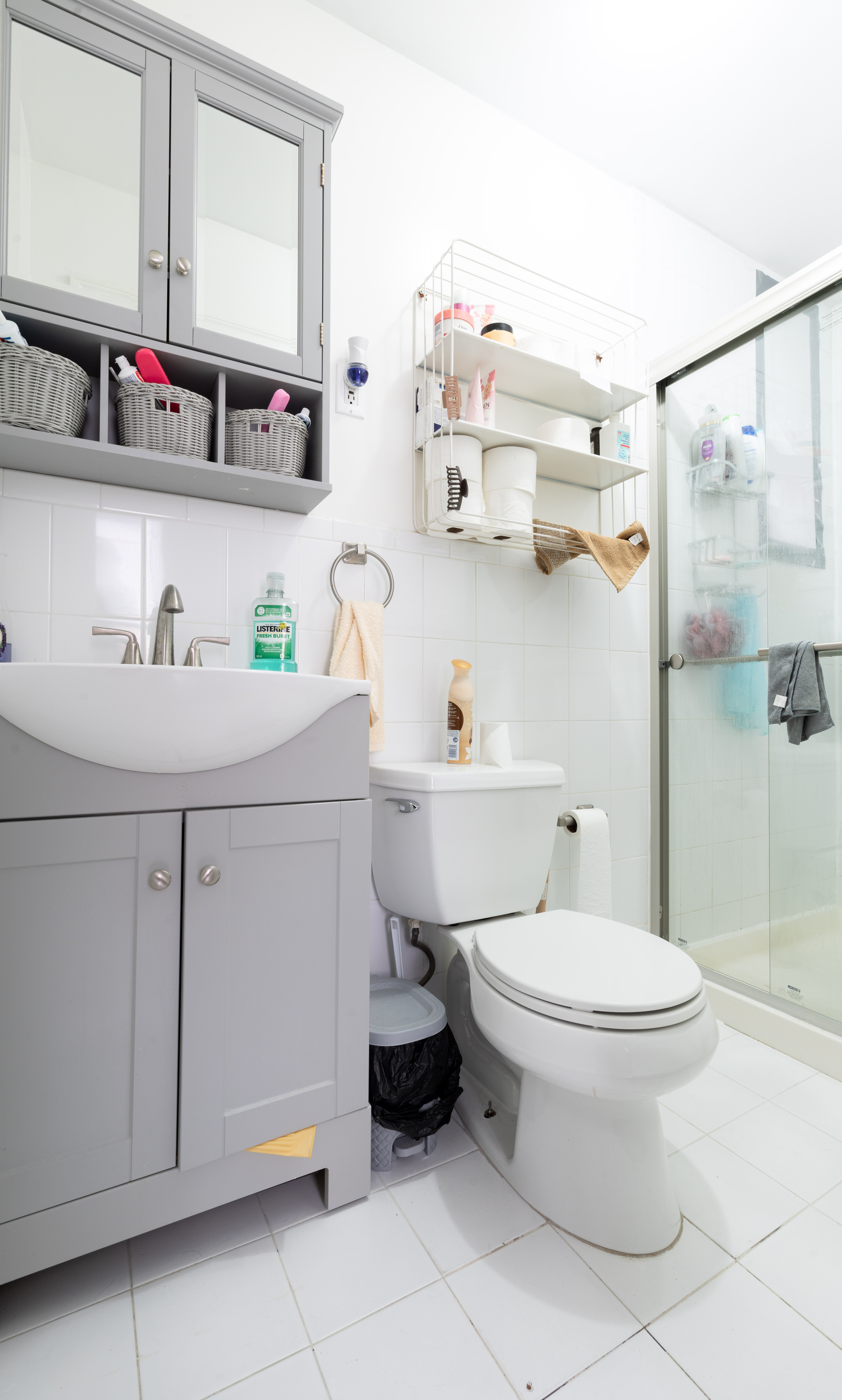 936 Seneca Avenue Queens, NY 11385 - Photo 9 of 12 a bathroom with a sink toilet and a mirror