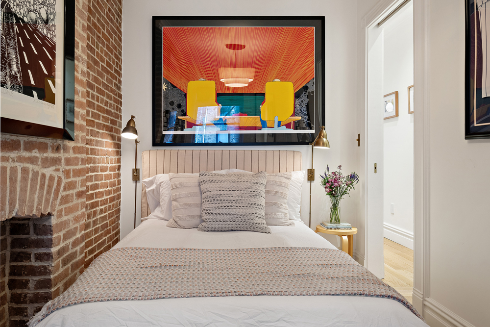 67 Perry Street, Unit 3 Manhattan, NY 10014 - Photo 16 of 22 a bedroom with a bed and a mirror