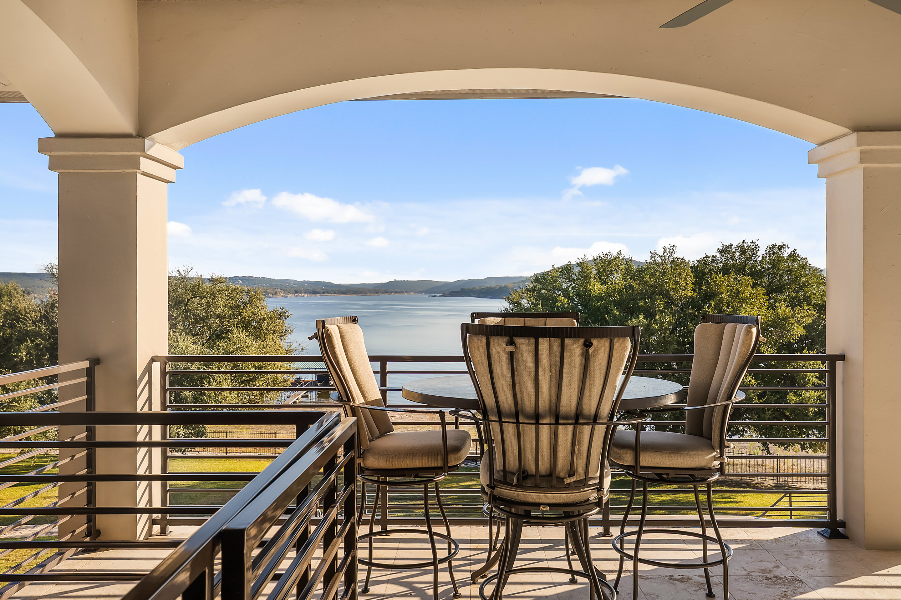 15210 Rainbow 1 Street Austin, TX 78734 - Photo 122 of 138 a view of a balcony with table and chairs