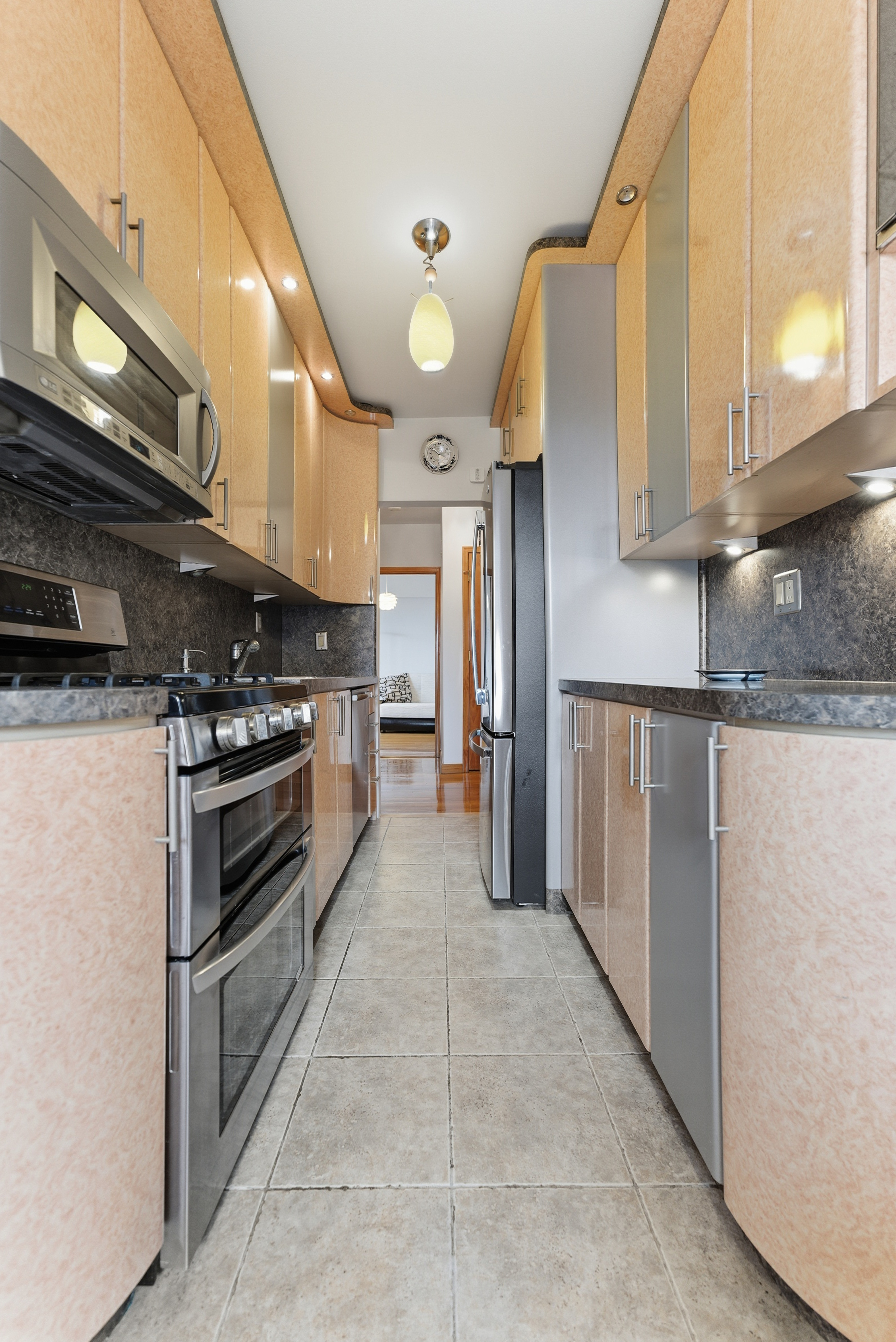3616 Henry Hudson Parkway, Unit 7GN Bronx, NY 10463 - Photo 13 of 17 a kitchen with stainless steel appliances granite countertop a refrigerator a stove and a sink with cabinets