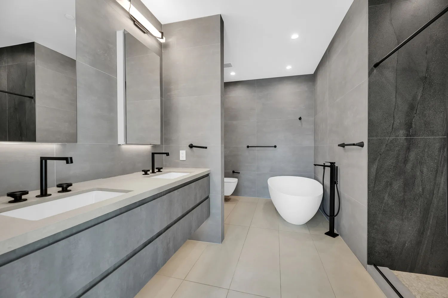 a bathroom with a double vanity sink and mirror