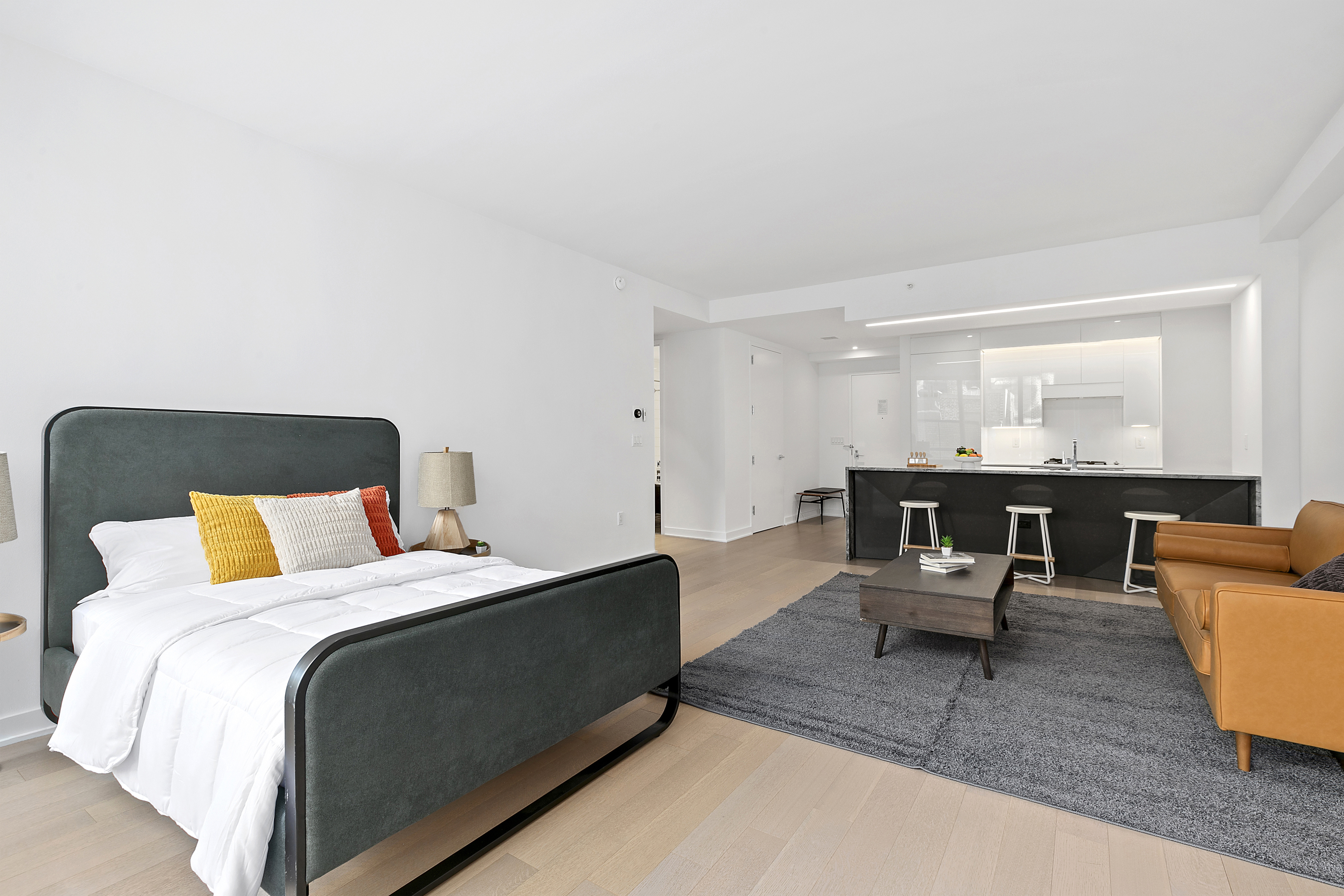 400 Park Avenue South, Unit 23G Manhattan, NY 10016 - Photo 2 of 7 a bed room with a bed and a couch