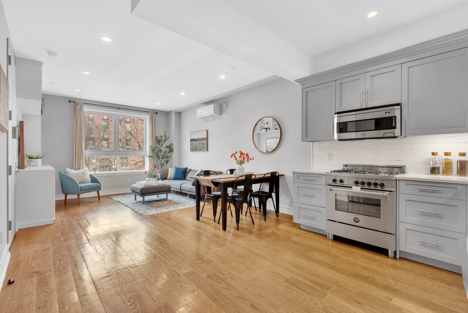 94 Lefferts Place, Unit 2 Brooklyn, NY 11238 - Photo 2 of 10 a living room with furniture a window and stainless steel appliances