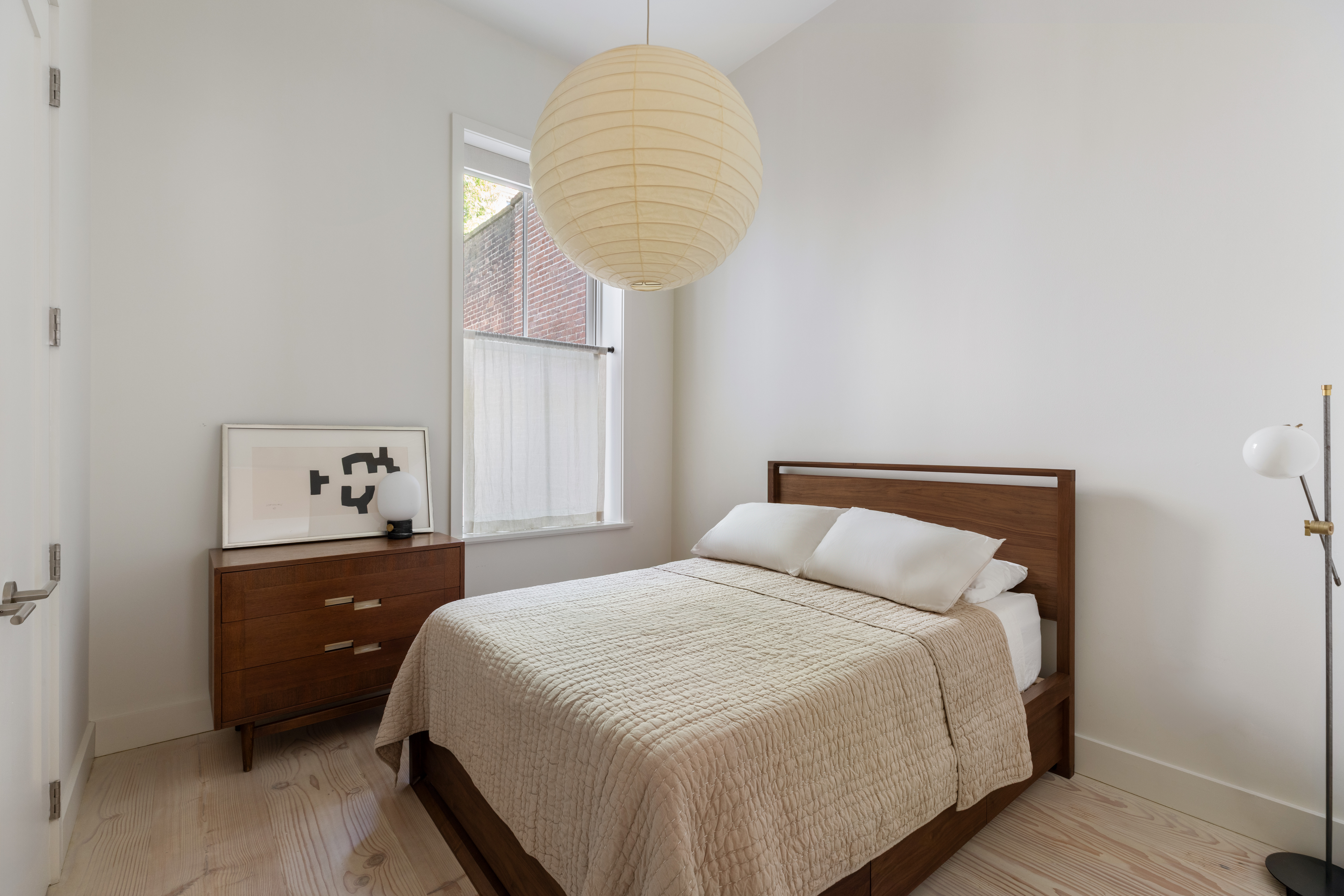113 Columbia Heights, Unit PARLOR Brooklyn, NY 11201 - Photo 9 of 12 a bedroom with a bed and a lamp