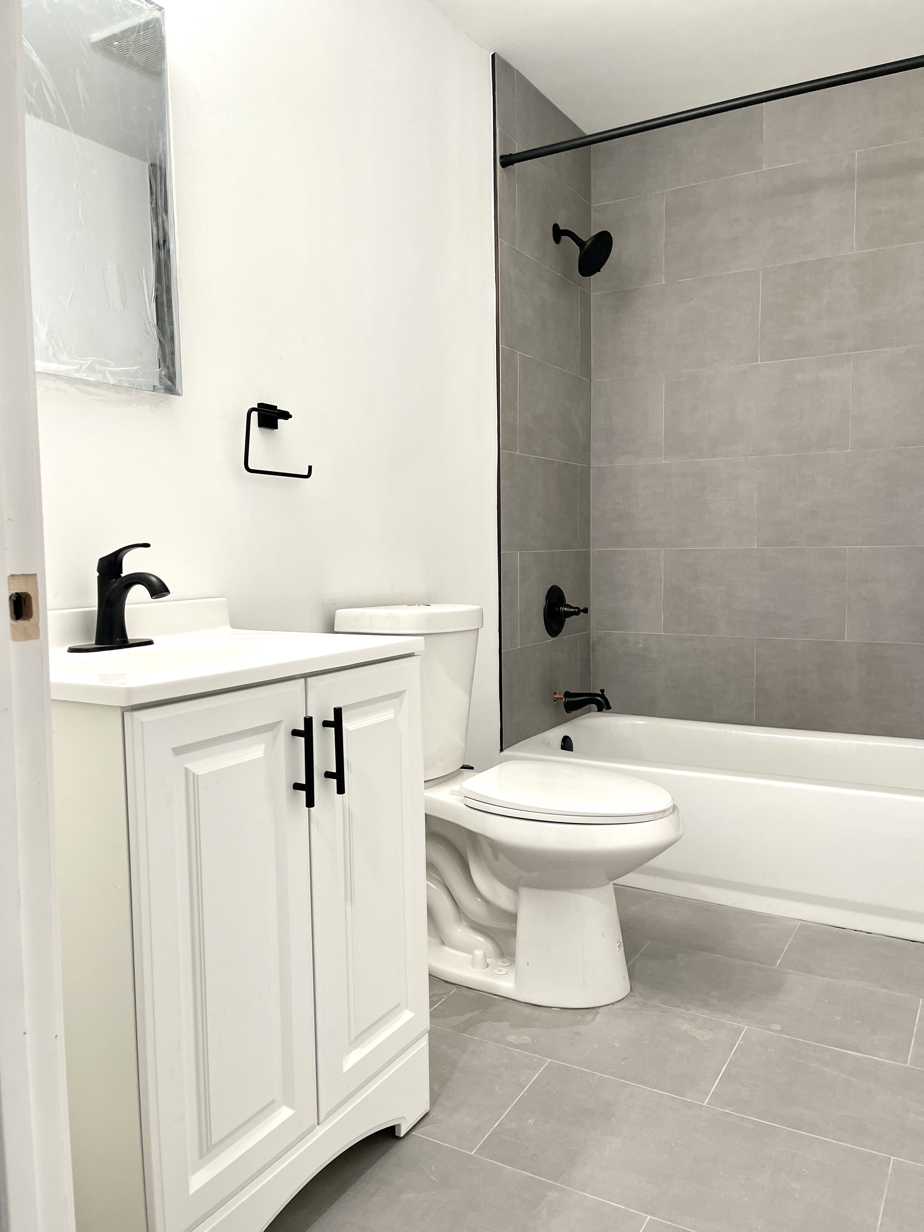 1999 3rd Avenue, Unit 1 Manhattan, NY 10029 - Photo 16 of 23 a bathroom with a toilet sink and shower