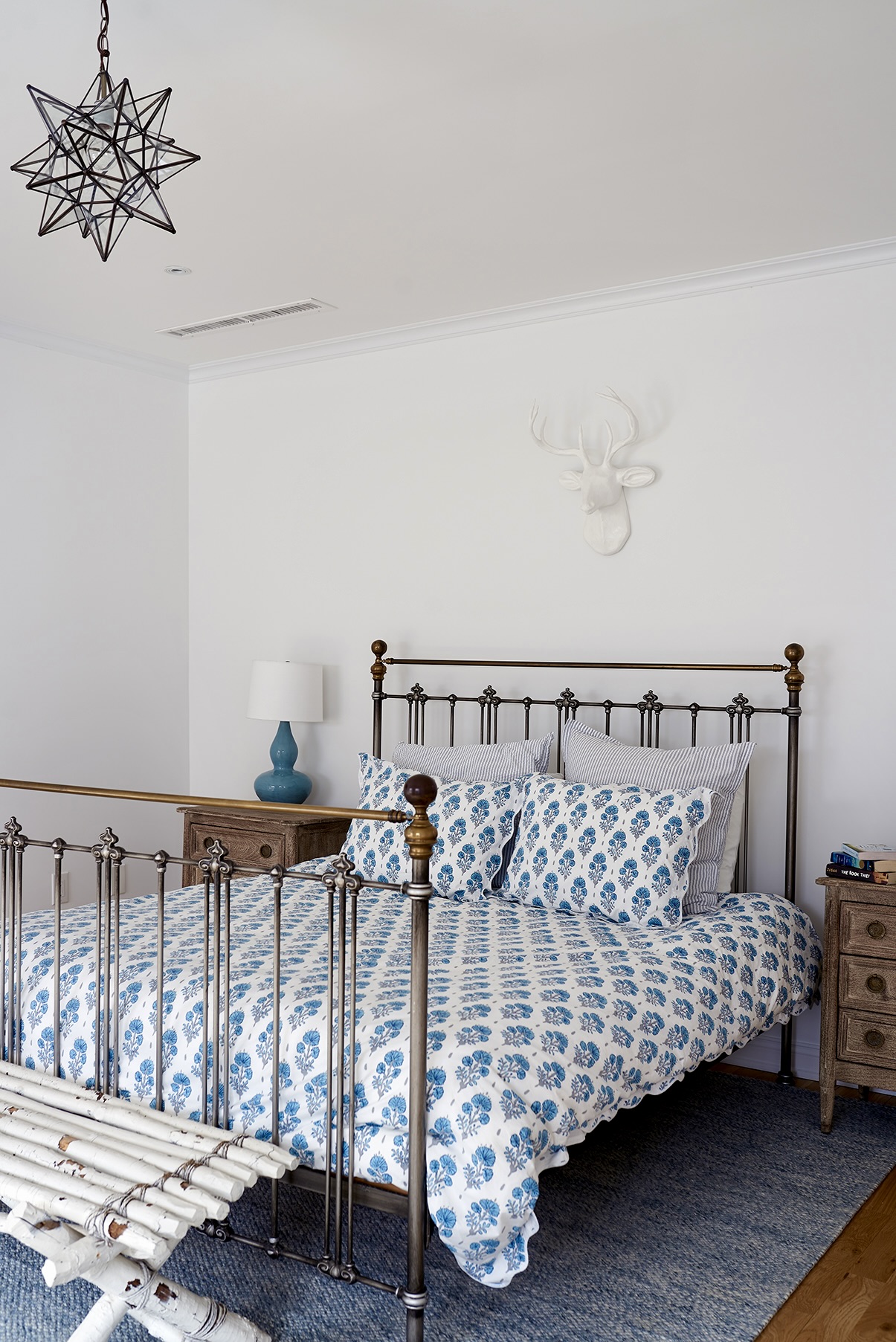 435 Clinton Avenue Brooklyn, NY 11238 - Photo 20 of 27 a bed sitting in a bedroom next to a window with a chandelier