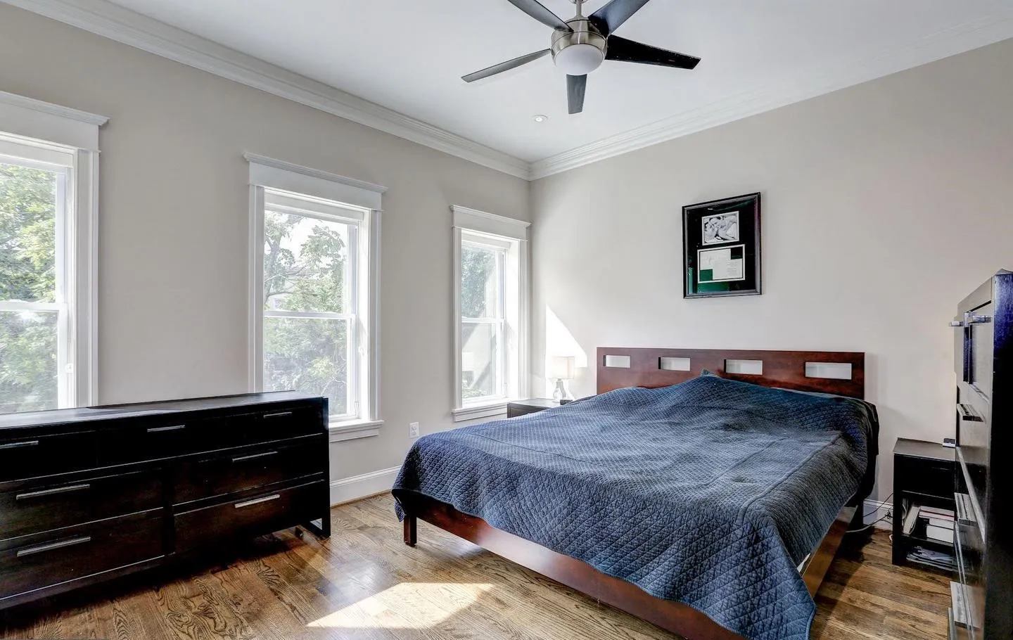 a bathroom with a granite countertop sink a toilet and a mirror