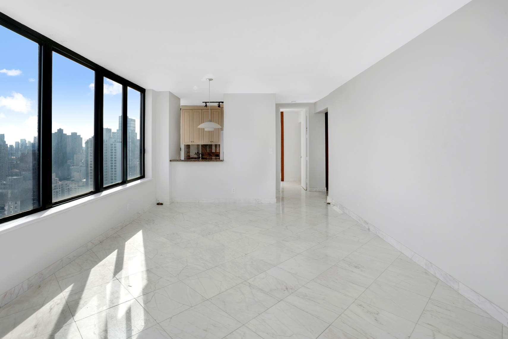 300 East 93rd Street, Unit 35D Manhattan, NY 10128 - Photo 6 of 13 a view of an empty room with glass door