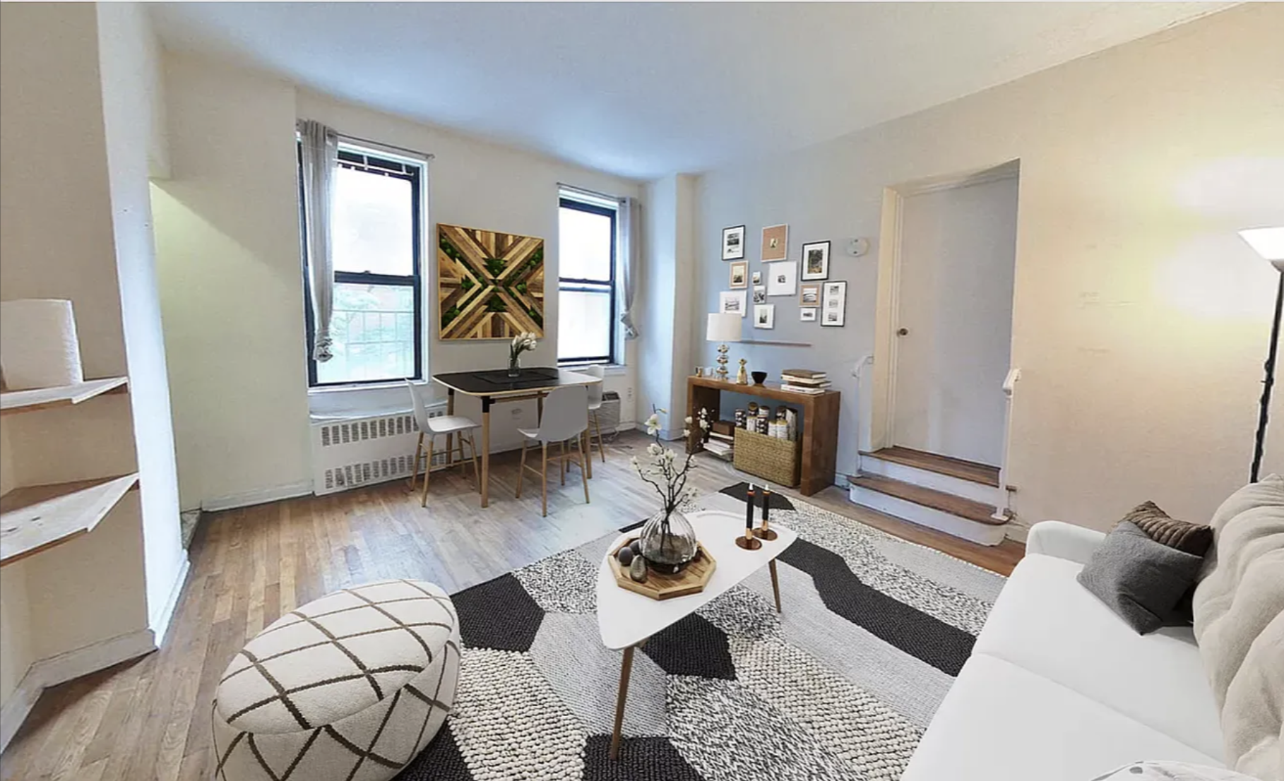 a living room with furniture and wooden floor