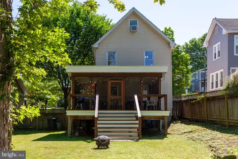a view of a house with a yard porch and a patio