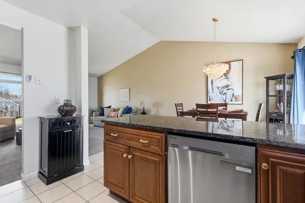 a living room with furniture a air conditioner and a window
