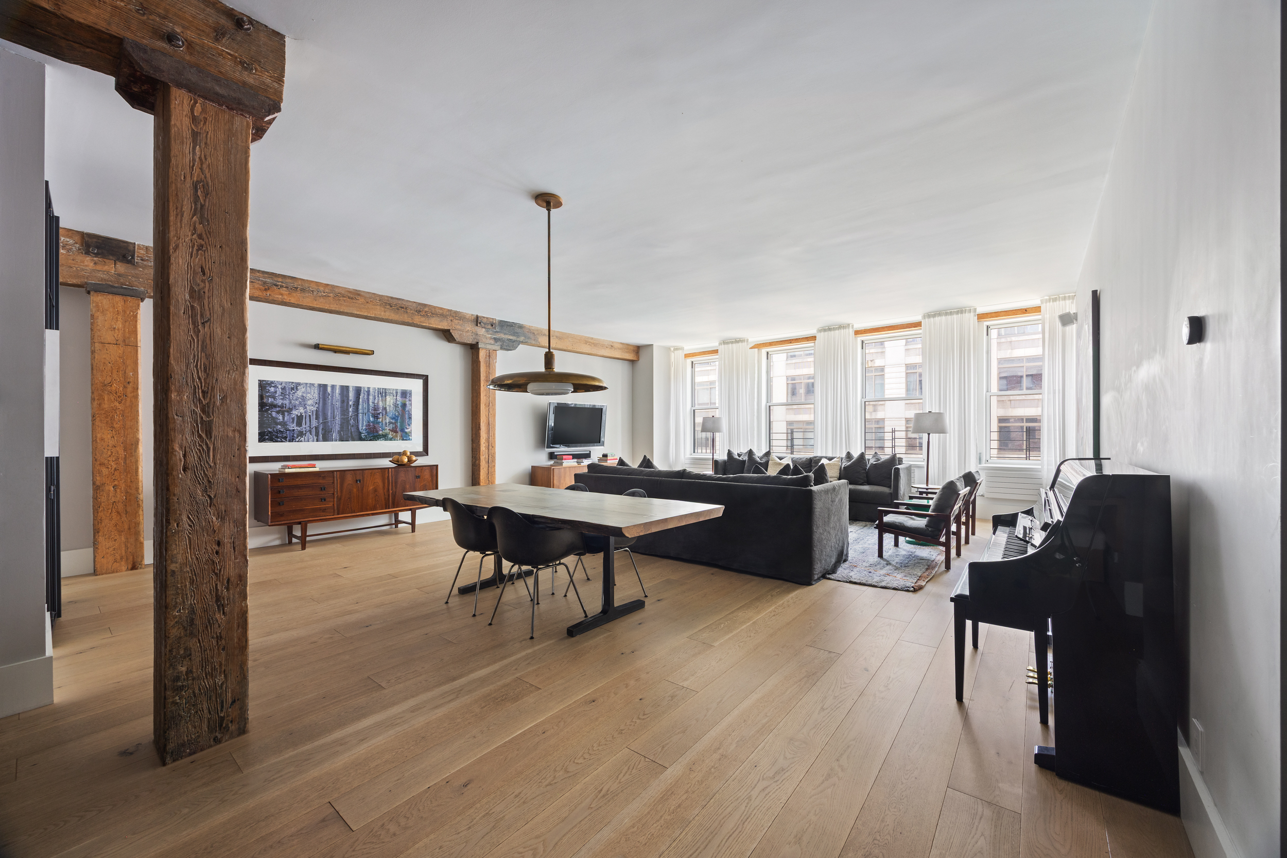 622 Greenwich Street, Unit 4B Manhattan, NY 10014 - Photo 2 of 27 a living room with furniture a table and chairs