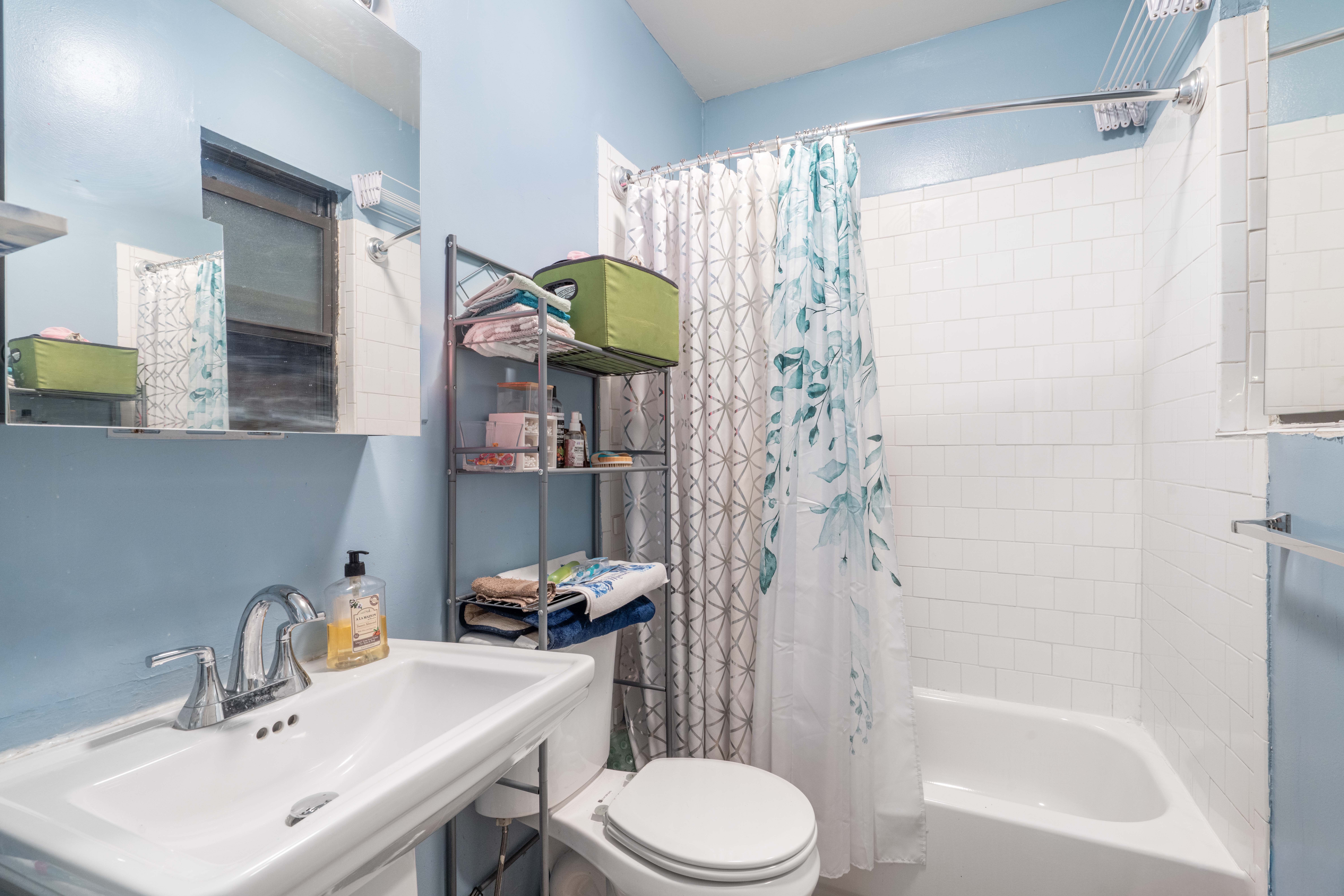 550 West 153rd Street, Unit 34 Manhattan, NY 10031 - Photo 7 of 8 a bathroom with a sink toilet and shower