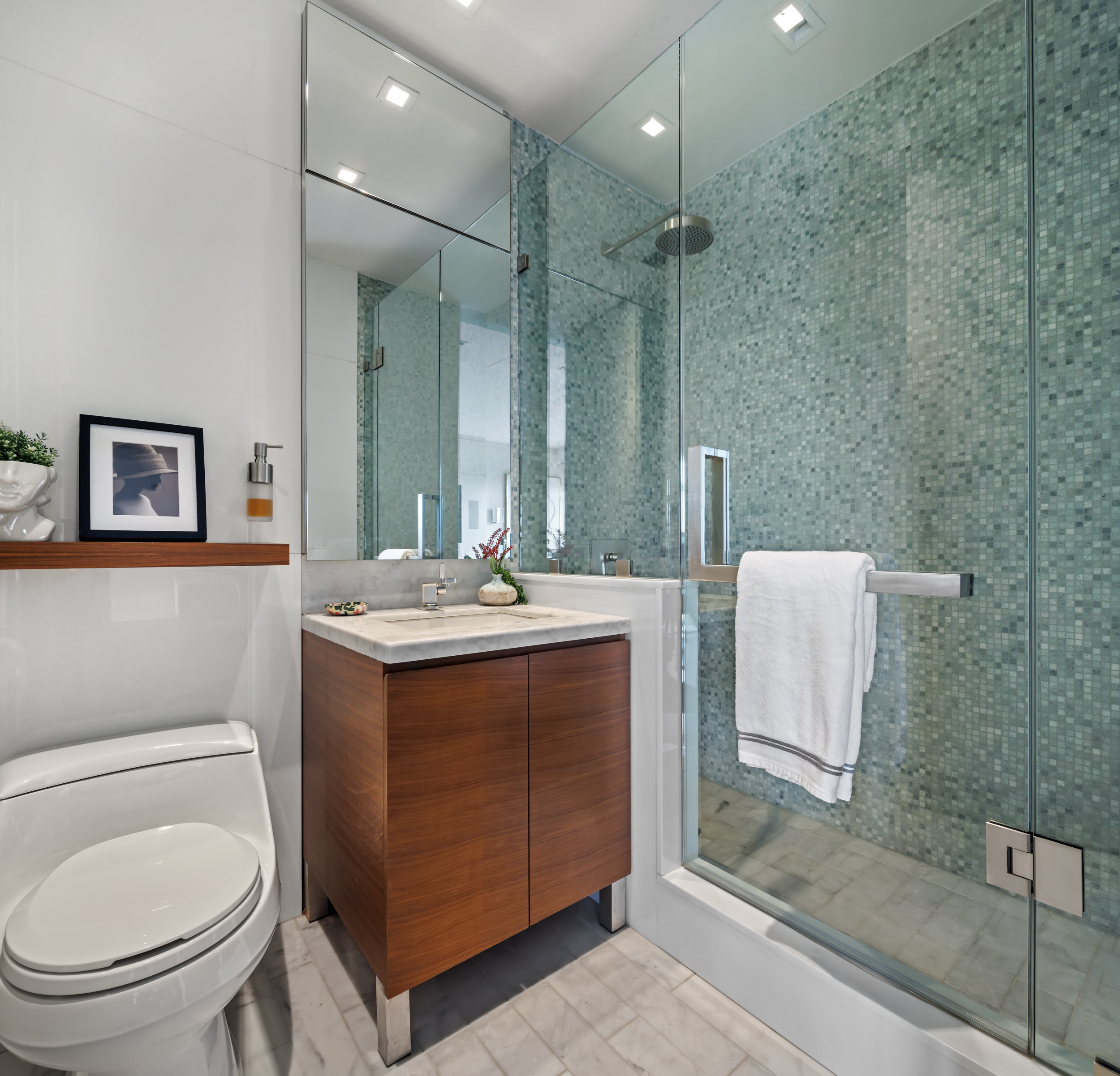 400 West 12th Street, Unit 4E Manhattan, NY 10014 - Photo 21 of 24 a bathroom with a toilet sink and mirror