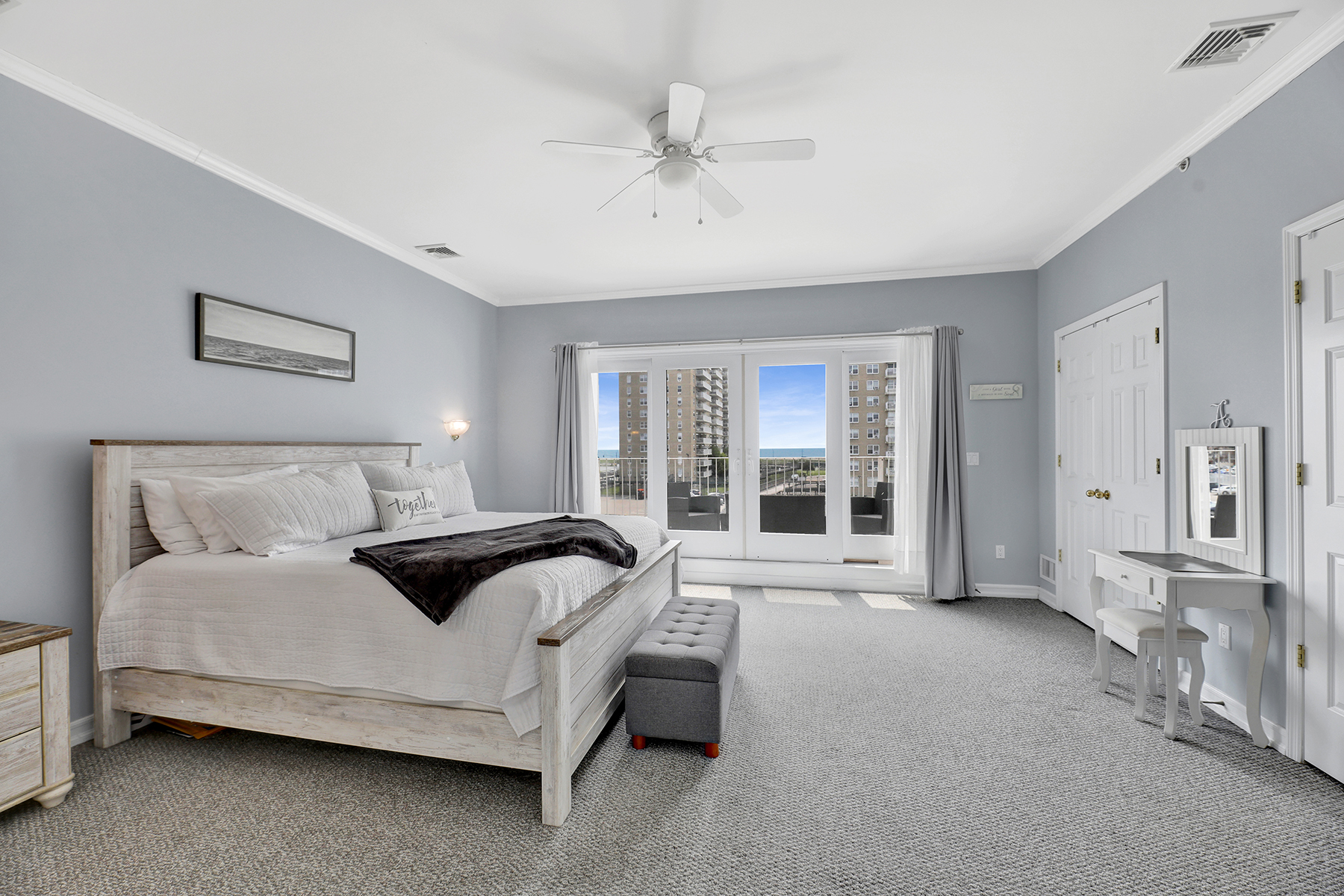 102-20 Rockaway Beach Boulevard, Unit 3C Queens, NY 11694 - Photo 2 of 36 a spacious bedroom with a bed and glass door