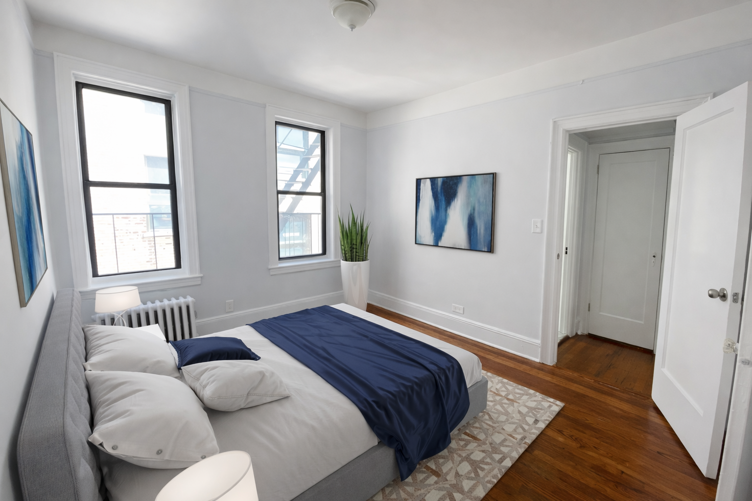 28-23 42nd Street, Unit C3 Queens, NY 11103 - Photo 4 of 6 a bedroom with furniture and wooden floor
