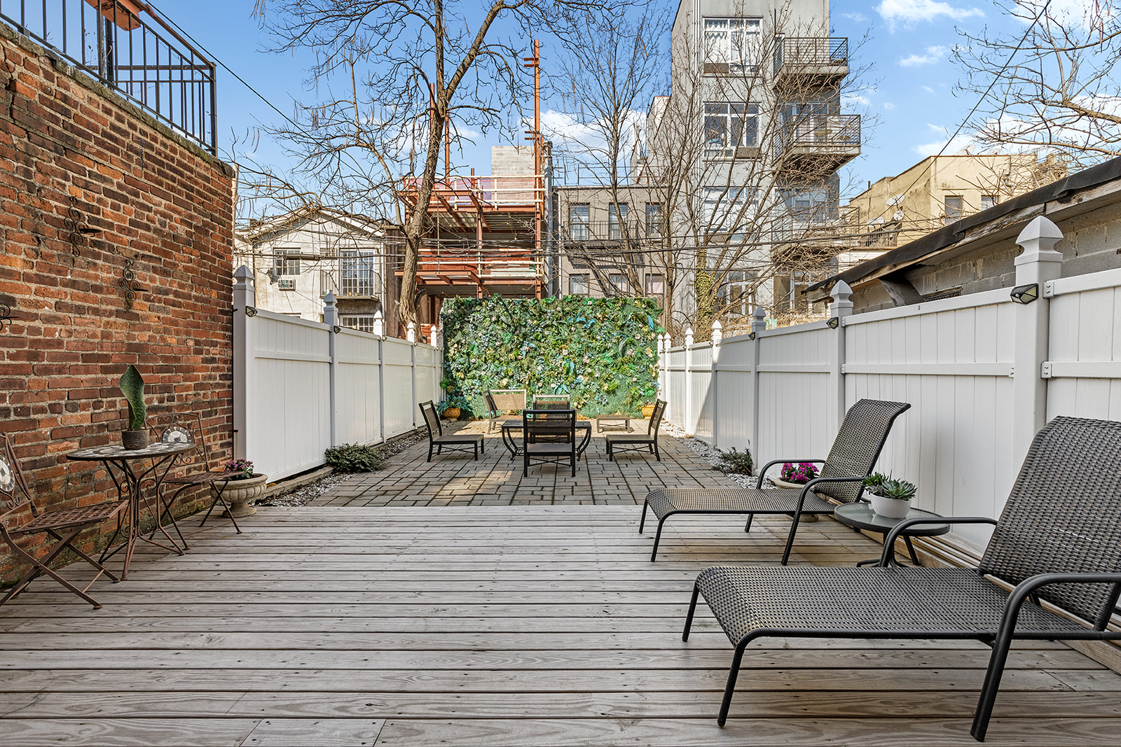 231 Vernon Avenue Brooklyn, NY 11206 - Photo 11 of 13 a view of a patio with dining table and chairs