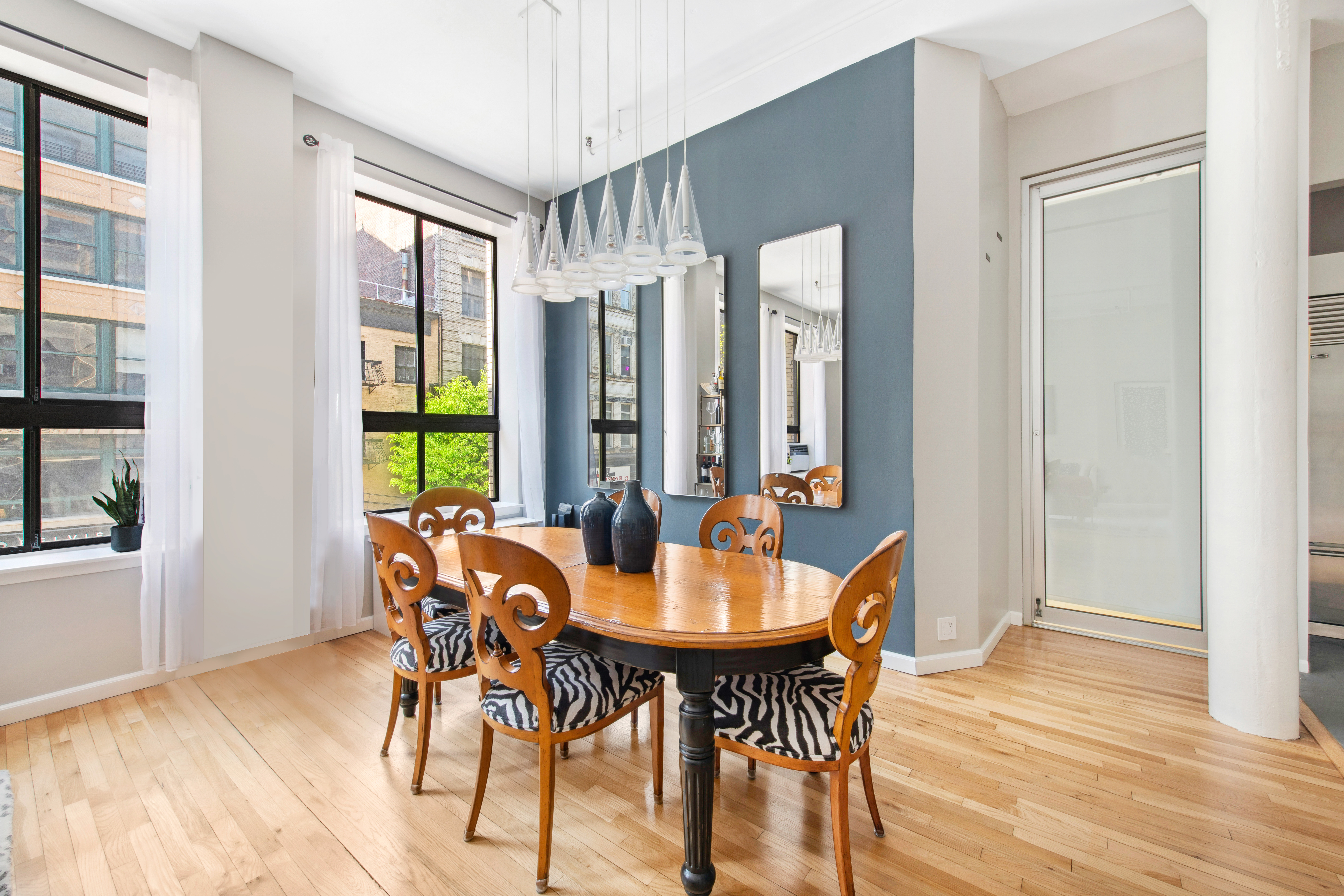 112 West 18th Street, Unit 2A Manhattan, NY 10011 - Photo 4 of 10 a view of a dining room with furniture and window