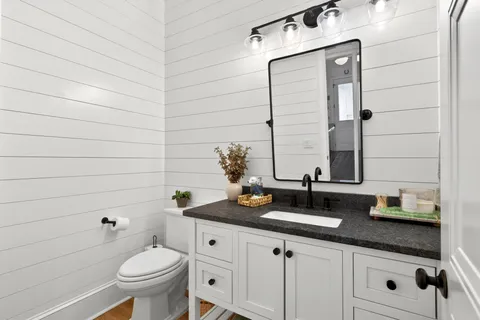 a living room with furniture flat screen tv and view of living room