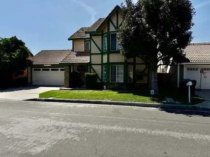 a house view with a garden space