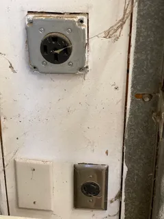 a room with gym equipment and a view of living room