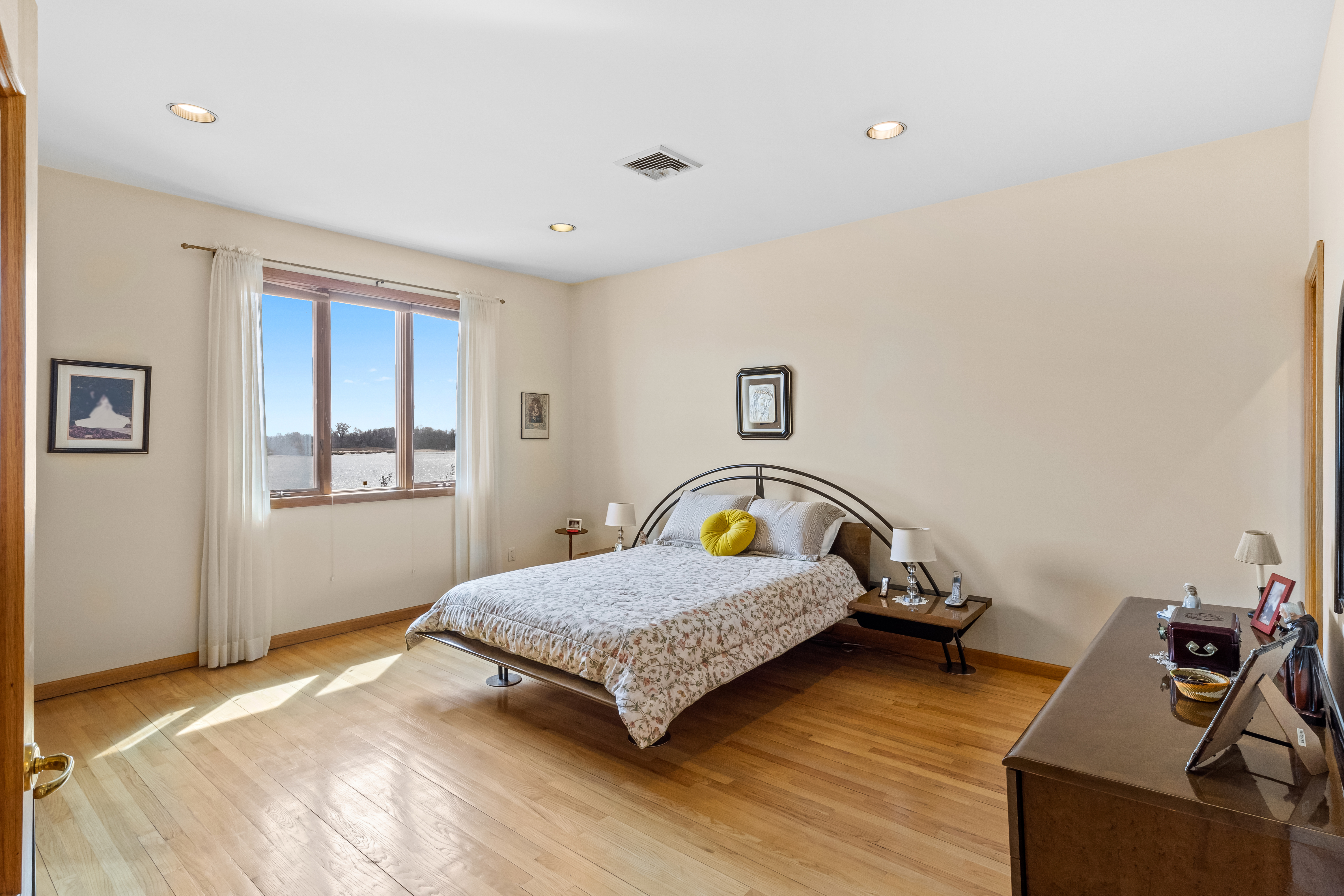 303 Whitman Drive Brooklyn, NY 11234 - Photo 16 of 37 a bedroom with a bed and wooden floor