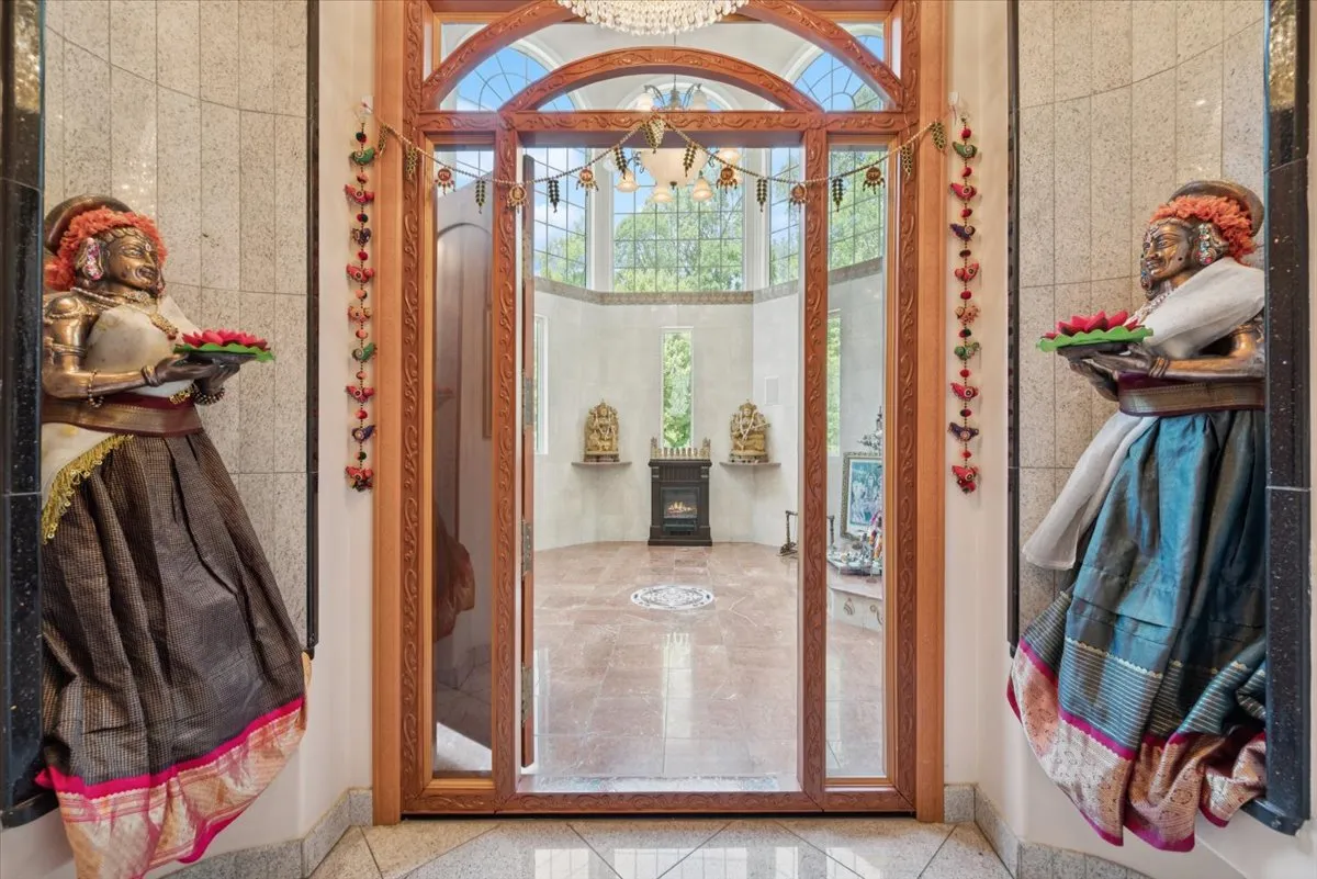 a view of a swimming pool with a patio and garden