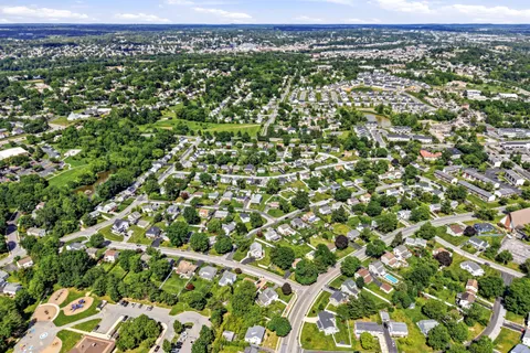 an aerial view of residential houses with outdoor space