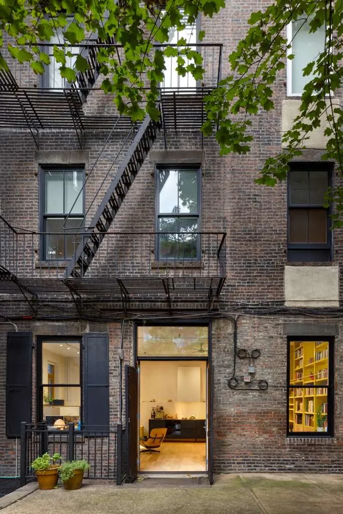 a picture of a bathroom with a white wall