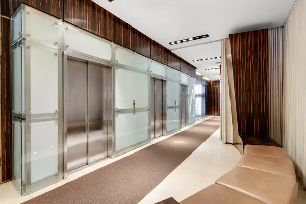 a view of a hallway with windows