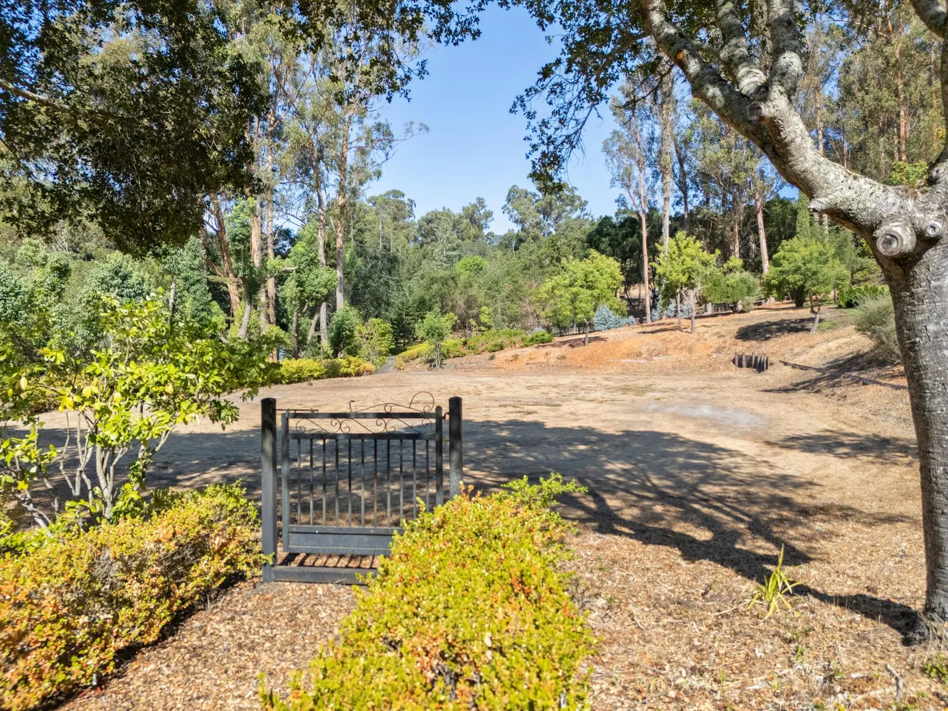 a view of a patio with table and chairs with wooden fence and floor