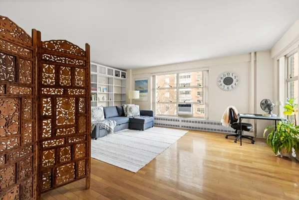 a living room with furniture and a window